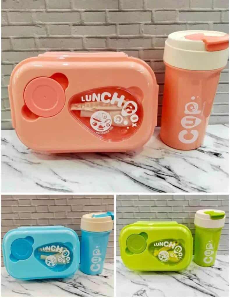 Une boîte à lunch rectangulaire aux bords arrondis avec un couvercle transparent au centre