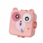 Une boîte à repas (lunch box) pour enfant de couleur rose pâle