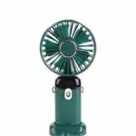 Mini ventilateur de poche vert bouteille avec des touches de doré sur la grille et les attaches latérales, présenté sur un fond blanc uni.