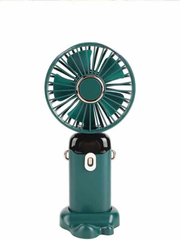 Mini ventilateur de poche vert bouteille avec des touches de doré sur la grille et les attaches latérales, présenté sur un fond blanc uni.
