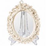Miroir ovale baroque blanc sur chevalet transparent